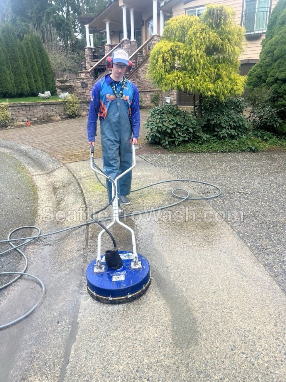 Professional driveway pressure washing in Kenmore, WA - moss and grime removal