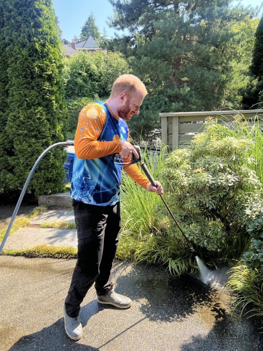 Dylan Thornsberry, owner of Seattle ProWash, performing professional pressure washing in Kenmore WA