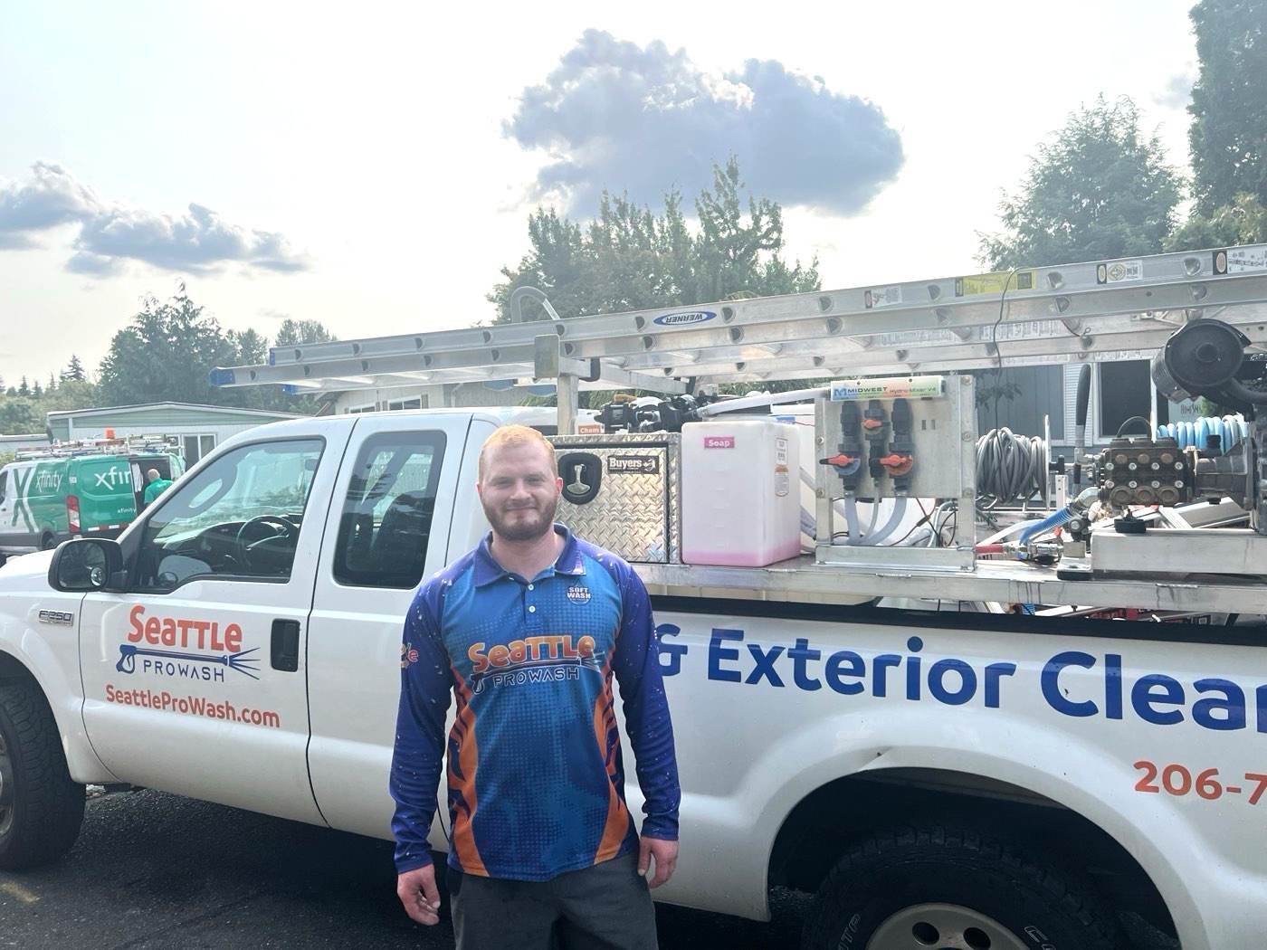 Dylan Thornsberry, owner of Seattle ProWash, standing in front of the company truck in Kenmore WA