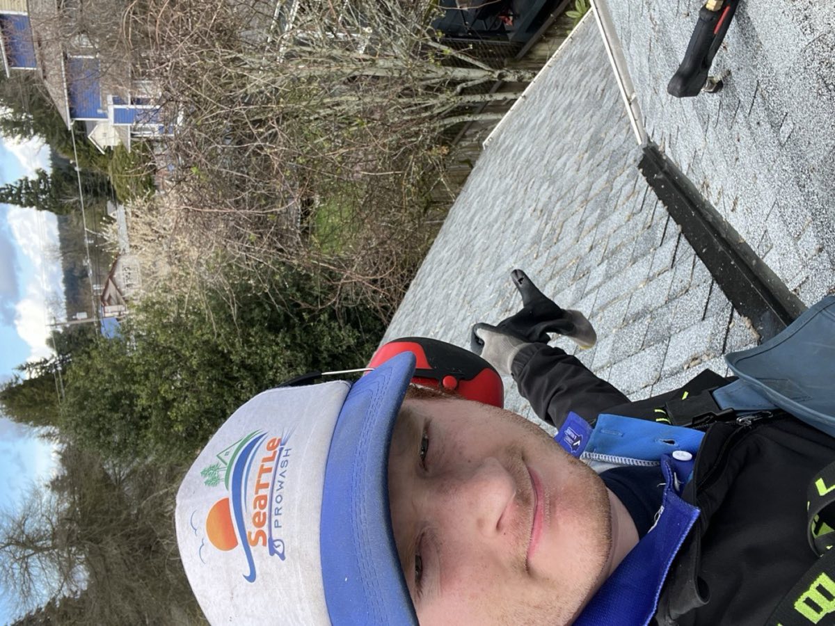 Dylan working on top of a residential roof