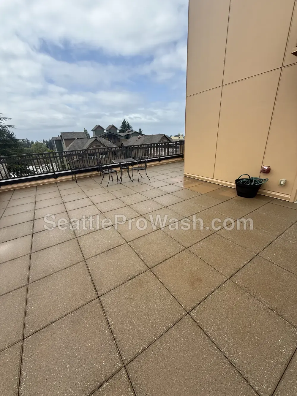 Concrete patio cleaning before and after in the Seattle area after cleaning