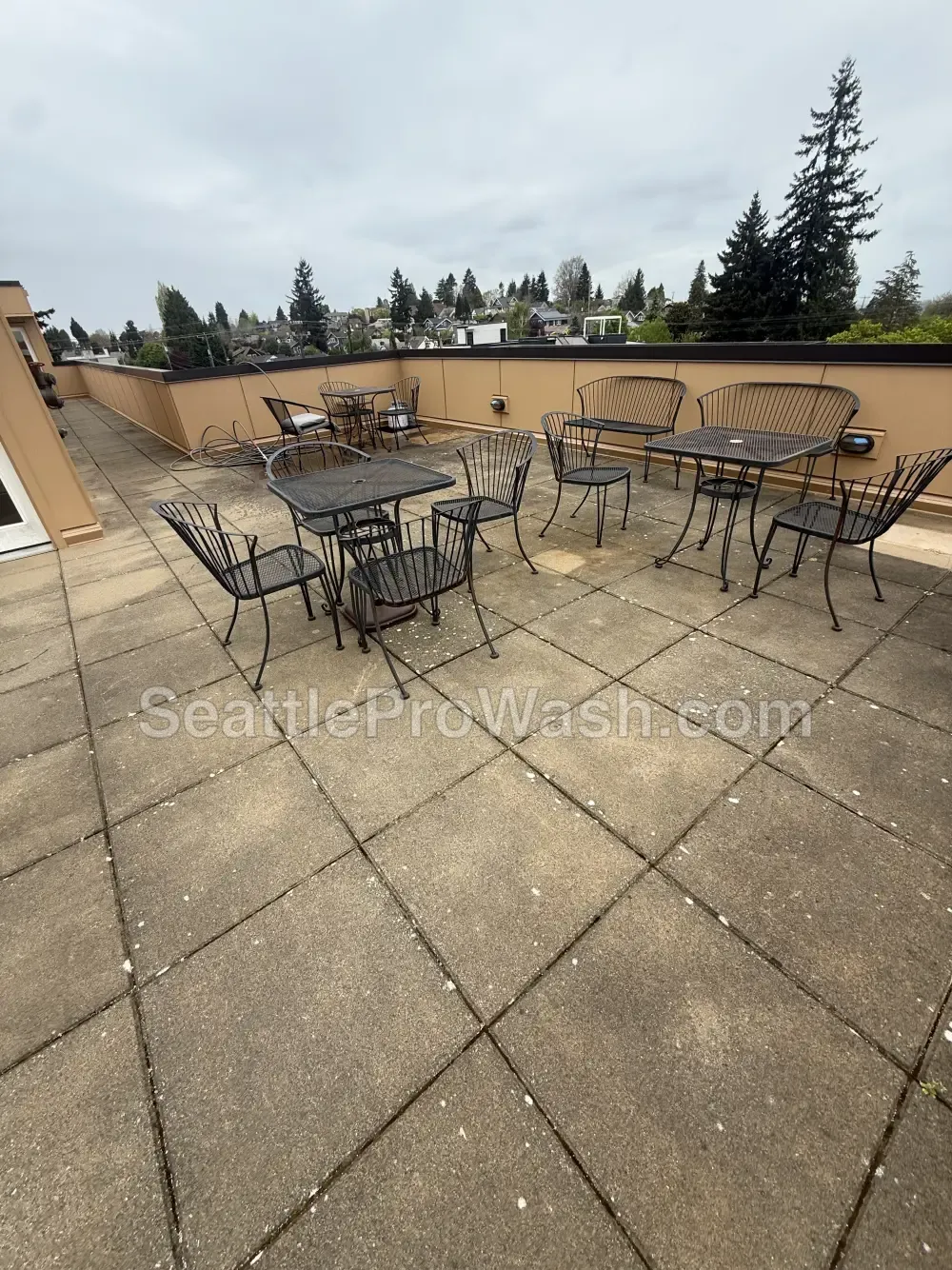 Rooftop patio pressure washing before and after in the Seattle area